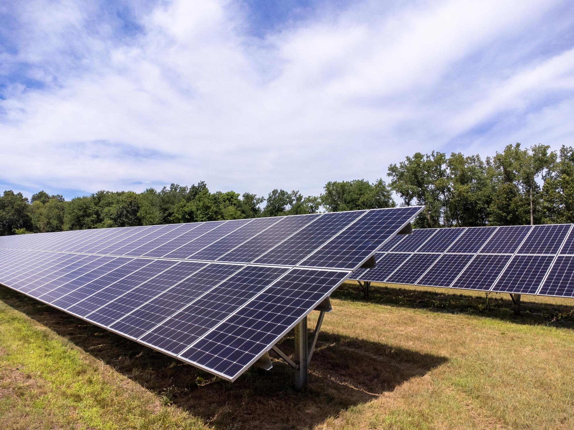 Commercial ground mount solar panel installation on open land in California for high energy output